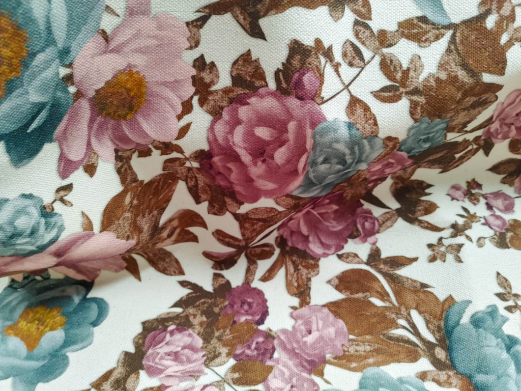 Detail of printed fabric with patterned flowers and leaves